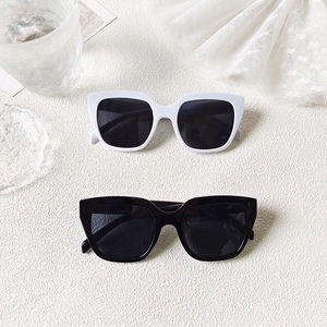 Minimalist square frame sunglasses in black and white with high-quality UV protection