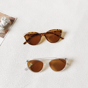 Cat eye triangle sunglasses for kids in leopard print and clear resin frames with brown lenses