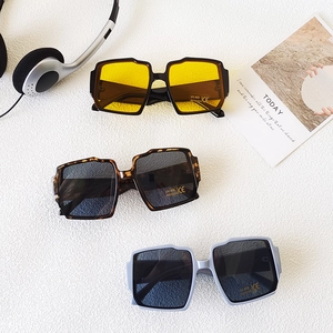 Kids UV400 irregular square sunglasses with wavy frames and gradient lenses shown in a group