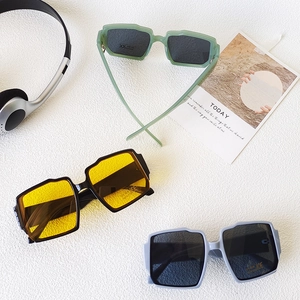 Detailed view of irregular geometric kids sunglasses with UV400 and CE marked lenses