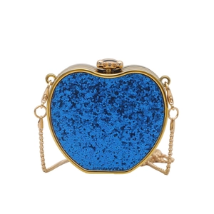 Detailed view of apple-shaped acrylic evening bag with blue glitter and gold metal edges
