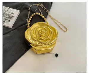 Detailed comparison of rose acrylic evening clutch size next to a smartphone
