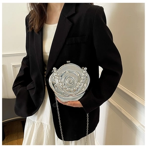 Detail of silver metallic 3D rose flower evening clutch bag with pearl bead accents