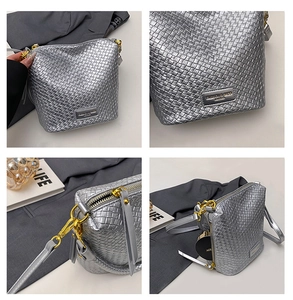 Detail showing silver woven texture with gold hardware and adjustable strap on bucket bag