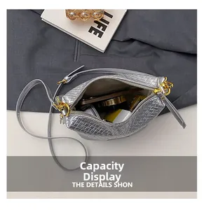 Top view of silver woven bucket bag showing spacious interior capacity and gold zipper