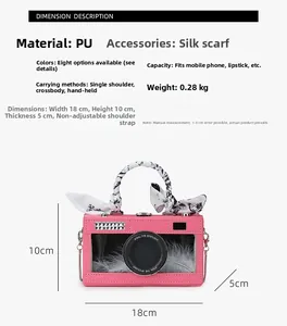 Pink camera-shaped handbag dimension details showing PU leather and feather decoration