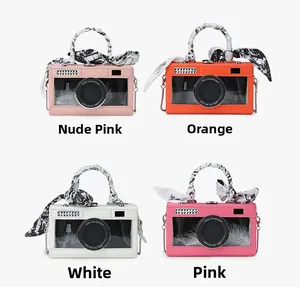 Detail of four colorful retro camera-shaped crossbody bags with silk-wrapped handles