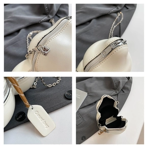Dettagli della borsa a forma di zucca bianco crema con zip argento e tracolla a catena