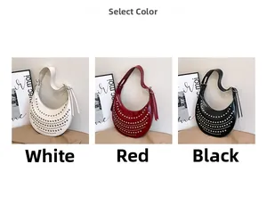 Crescent rivet bag shown in white, red, and black featuring glossy finish and adjustable strap