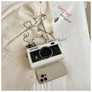 Creative camera-shaped white crossbody bag with floral scarf handle and chain strap details