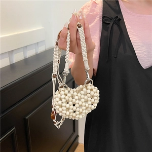 Handmade heart-shaped beaded handbag with woven rope handle and wooden beads