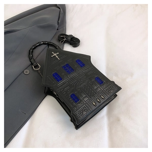 Detailed view of Gothic house-shaped handbag with rivet cross and faux leather texture