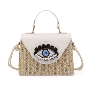 Bohemian beige straw crossbody bag with evil eye beadwork and crystal tassels