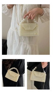 Detail of handmade cream pearl woven bag with gold chain strap and large pearl handle