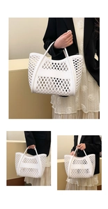 Close-up of white PVC hollowed-out beach bag with seamless handle and weave texture