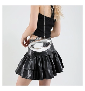 Close-up of pebble-shaped silver acrylic clutch with metallic finish and sphere clasp