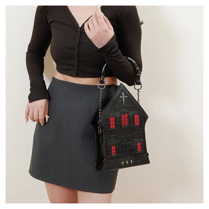 Gothic cathedral shaped handbag with red window details and bamboo top handle