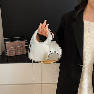 Silver heart-shaped mirror acrylic handbag with metallic top handle and chain strap