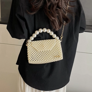 Handmade pearl woven crossbody bag with large pearl handle and gold chain strap