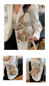 Detail of creative rabbit shaped bag with gold glitter finish and white bow accent