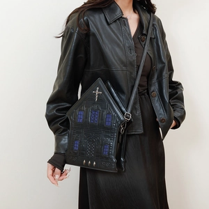 Gothic cathedral style crossbody bag in black PU leather featuring purple hollow details