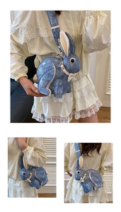 Detailed views of creative rabbit-shaped crossbody bag in textured blue and white leather
