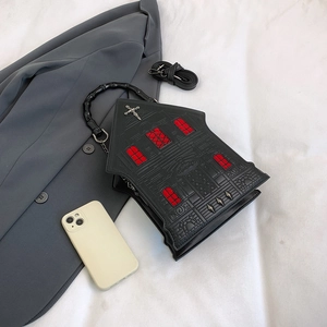 Gothic church-shaped handbag with red window details and unique black bamboo handle