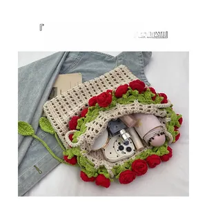 Spacious interior of hand-crocheted beige bag with rose decor holding summer essentials