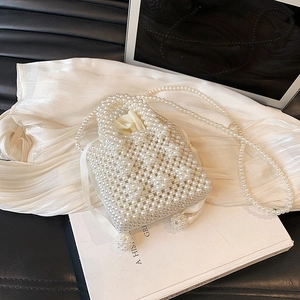 Handmade woven pearl handbag with satin drawstring lining and detachable crossbody chain