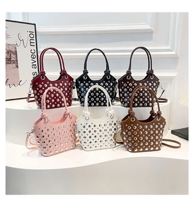 Detail showing various colors of studded bucket bags with metallic rivet decorations