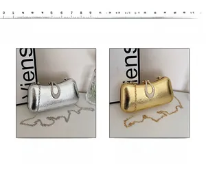 Detail view of metallic evening clutch bags with rhinestone U-buckle and chain strap