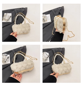 Detail of sweet chiffon flower evening bag with pearl handle and wavy box structure