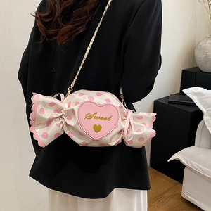 Kawaii candy shaped crossbody bag with pink polka dots and golden chain strap