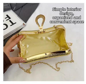 Interior view of gold evening clutch with satin lining and minimalist storage design