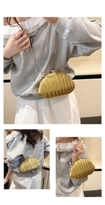 Three-way view of a gold pleated clutch shell bag with a stylish metal chain strap