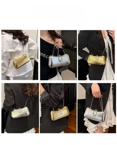 Detail view of glossy evening clutch bags with horseshoe buckle and detachable chain straps