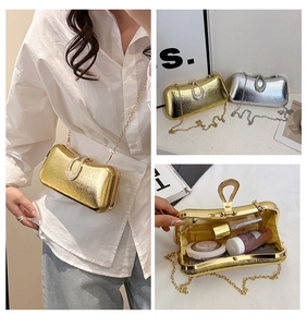 Detail of luxury evening clutch showing interior storage for perfume and lipstick