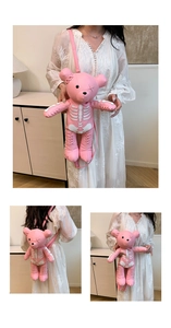 Detail of pink bear-shaped PU leather backpack with white bone prints and cross-stitching