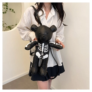 Close-up of skeleton bear backpack with white bone print and hand-stitched details