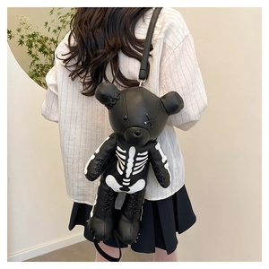 Detail of bear backpack showing the unique white skeleton print on lychee textured leather