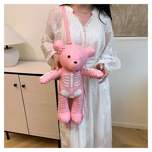 Pink cartoon bear crossbody bag with skeleton rib print and stitch detail on shoulder strap