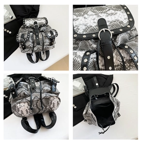 Detail view of snakeskin pattern backpack with silver studs and drawstring closure