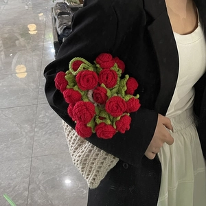 Handmade crochet summer shoulder bag with large red rose bouquet design and woven texture