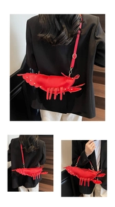 Detail shots of a creative red lobster shaped crossbody bag with gold rivet accents