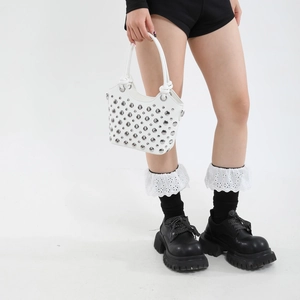 White faux leather bucket bag with silver punk rivets and circular top handle
