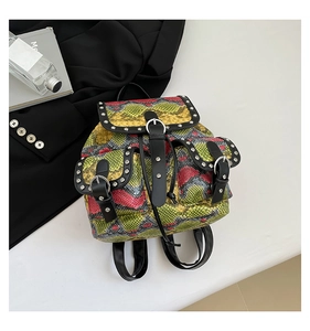 Detail of colorful snakeskin pattern backpack with silver studs and multi-pocket design