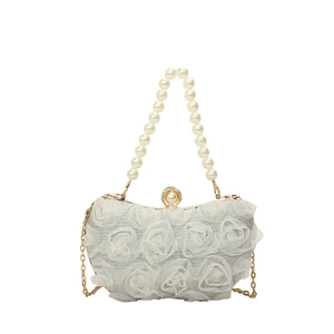 Elegant white lace floral evening bag with pearl handle and golden chain strap