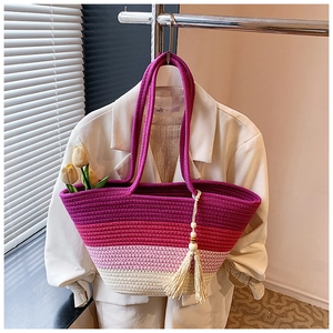 Detail of multi-color gradient woven tote bag with wooden beads and tassel charms