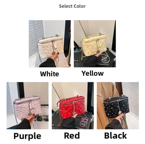 Quilted mini chain bag display in five colors with diamond accents and heart charms