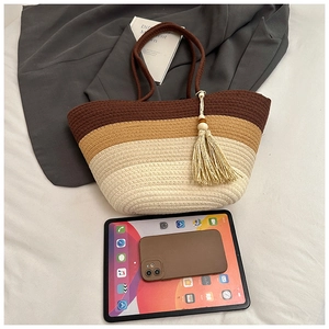 Close-up of woven tote bag texture with three-tone gradient and stylish cotton tassels